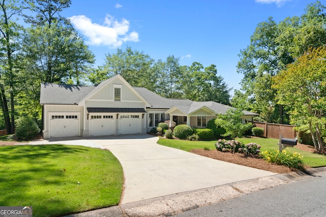 craftsman-style home with a front lawn and a garage