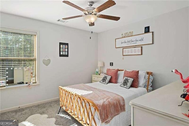 carpeted bedroom featuring ceiling fan