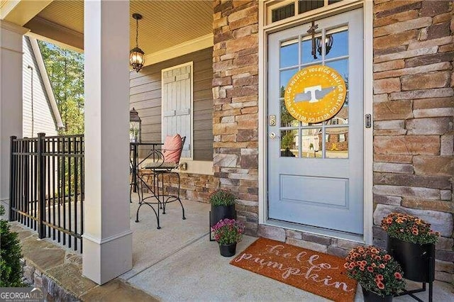 property entrance featuring covered porch