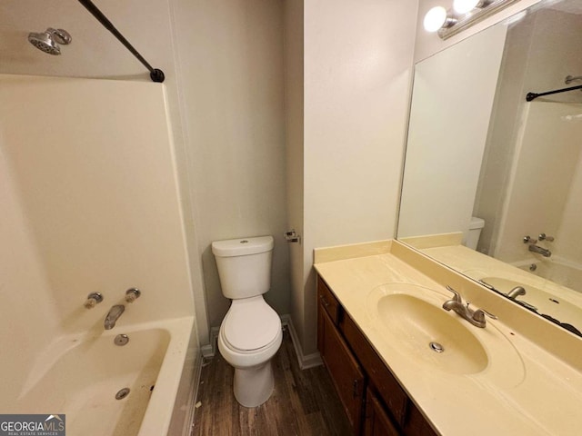 full bathroom with vanity, shower / bathing tub combination, wood-type flooring, and toilet