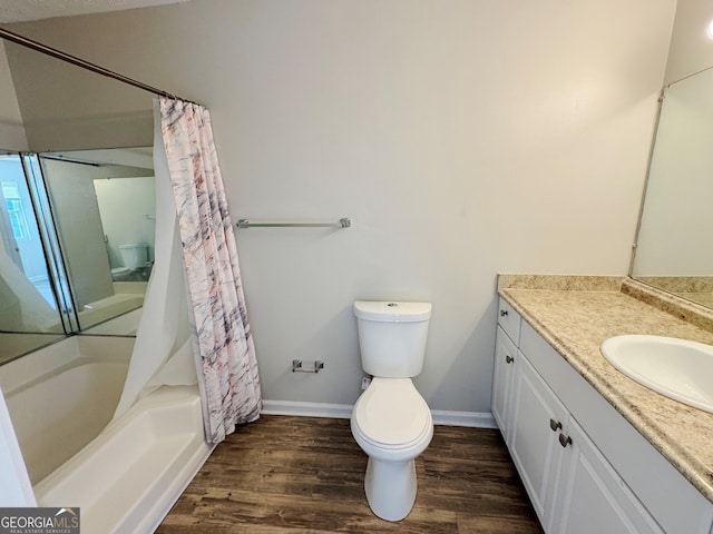 full bathroom with shower / bath combo, wood-type flooring, vanity, and toilet