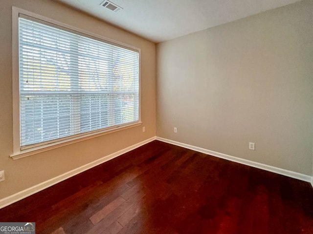 empty room featuring hardwood / wood-style flooring