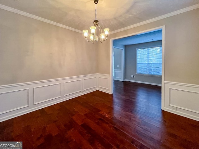 unfurnished dining area with an inviting chandelier, crown molding, and dark hardwood / wood-style flooring