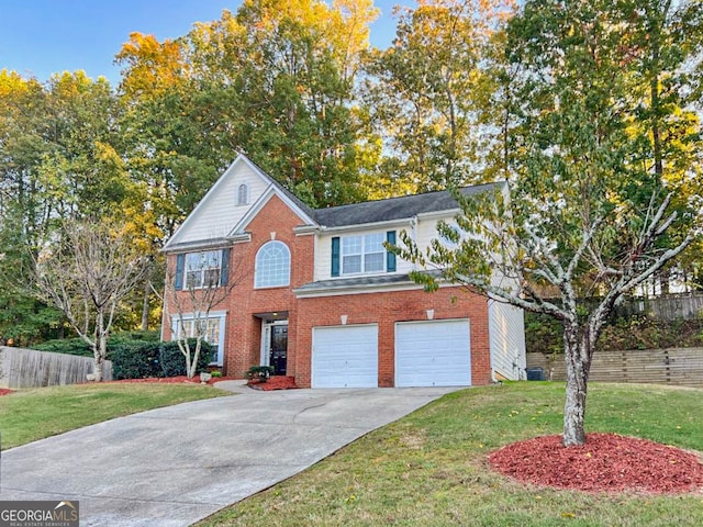 view of front of house featuring a front yard and a garage