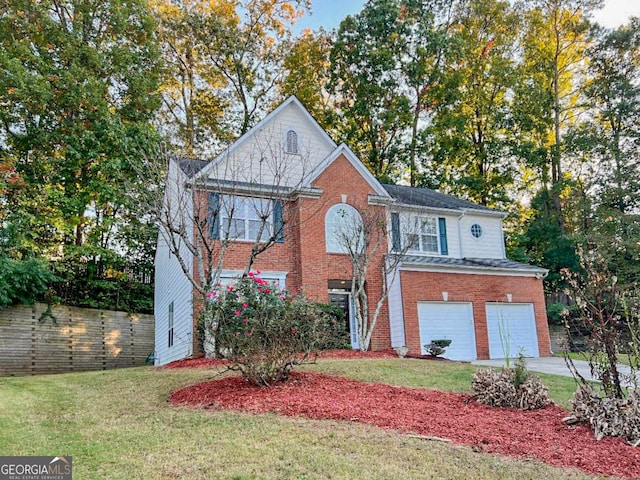 view of front of property featuring a garage and a front lawn