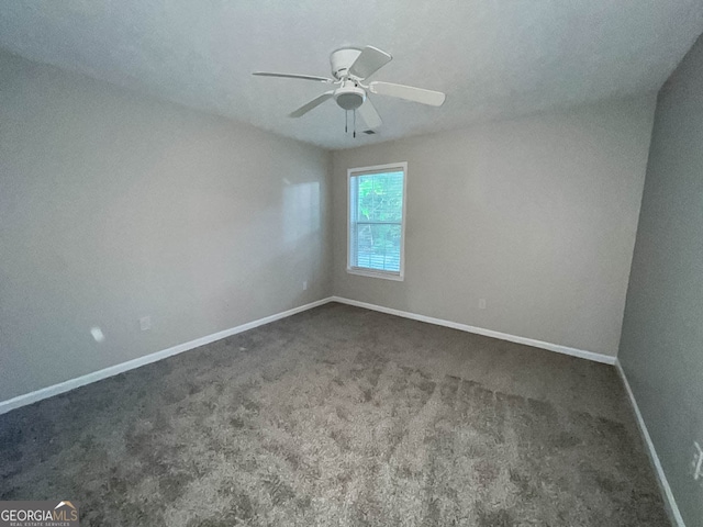 empty room with carpet floors and ceiling fan