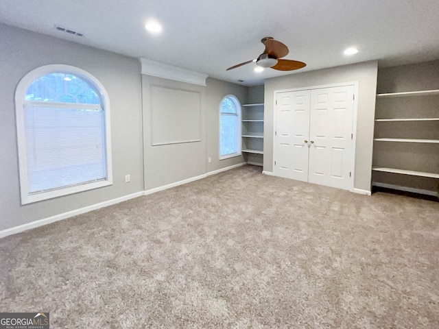 unfurnished bedroom with carpet and ceiling fan