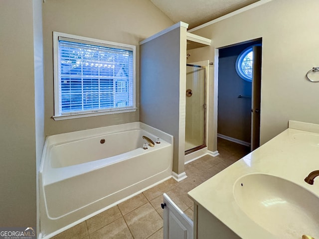 bathroom featuring vanity, tile patterned floors, a textured ceiling, and plus walk in shower