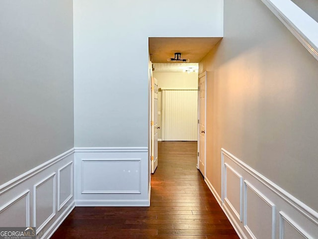 hall with dark wood-type flooring