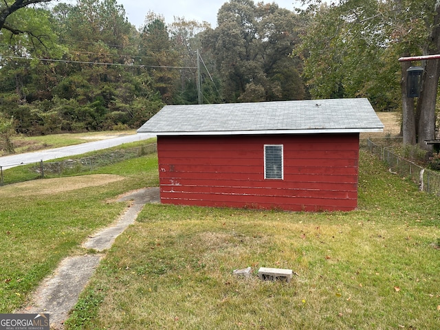 view of outbuilding with a lawn