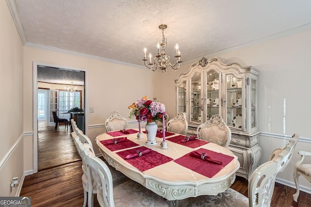 2582 Fairview Ln, Jonesboro, GA 30236 - dining room with a notable chandelier, crown molding, and dark wood-style flooring