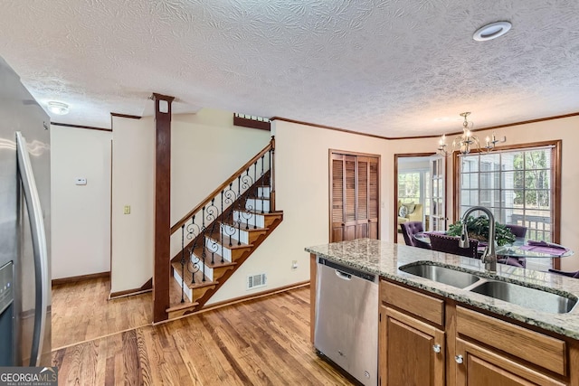 2582 Fairview Ln, Jonesboro, GA 30236 - kitchen featuring a sink, visible vents, appliances with stainless steel finishes, and light wood finished floors