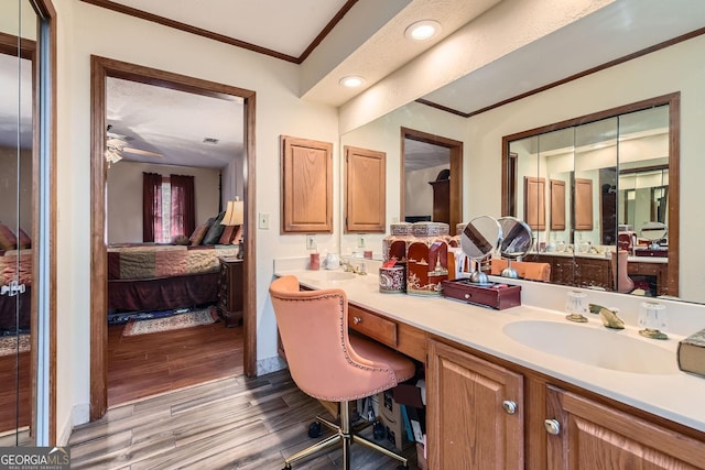 2582 Fairview Ln, Jonesboro, GA 30236 - ensuite bathroom with vanity, wood finished floors, recessed lighting, crown molding, and connected bathroom