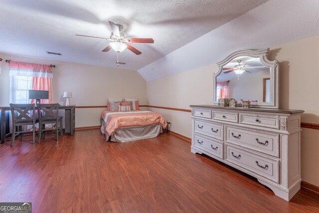 2582 Fairview Ln, Jonesboro, GA 30236 - bedroom with lofted ceiling, wood finished floors, visible vents, and baseboards