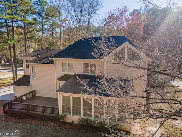 2582 Fairview Ln, Jonesboro, GA 30236 - rear view of house featuring roof with shingles and a deck