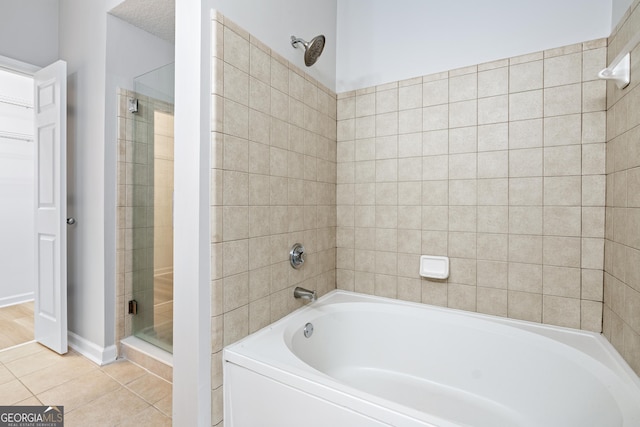 bathroom featuring tile patterned flooring and plus walk in shower