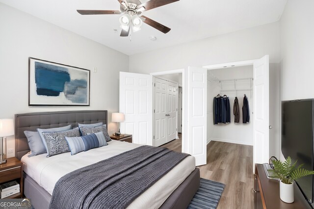 bedroom with ceiling fan and hardwood / wood-style floors