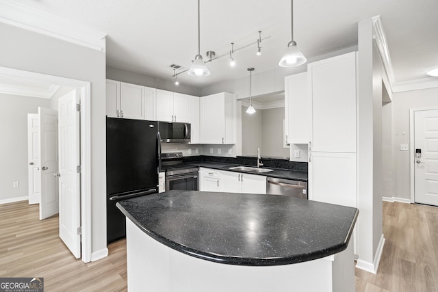 kitchen with white cabinets, a kitchen island, sink, and stainless steel appliances