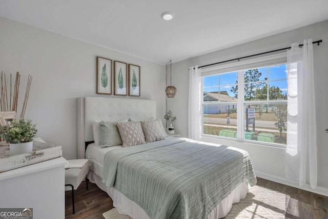 bedroom with hardwood / wood-style flooring