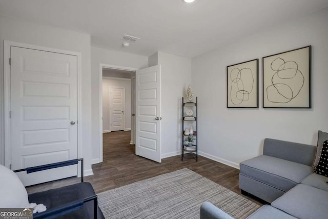 living room with dark hardwood / wood-style floors