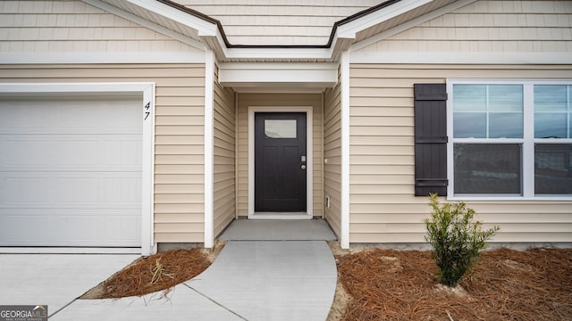 doorway to property featuring a garage