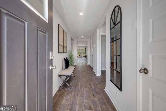 corridor featuring hardwood / wood-style floors