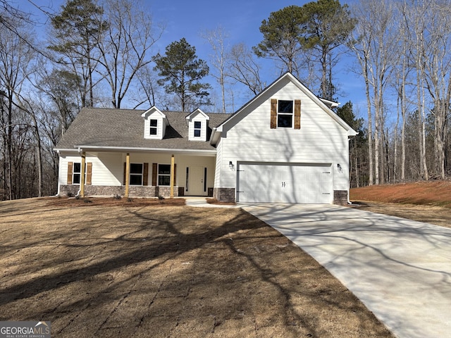 view of front of home featuring a garage and a porch