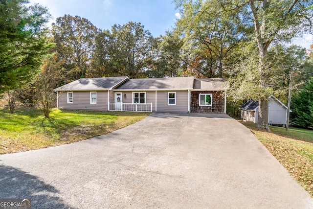 ranch-style home with a porch and a front lawn