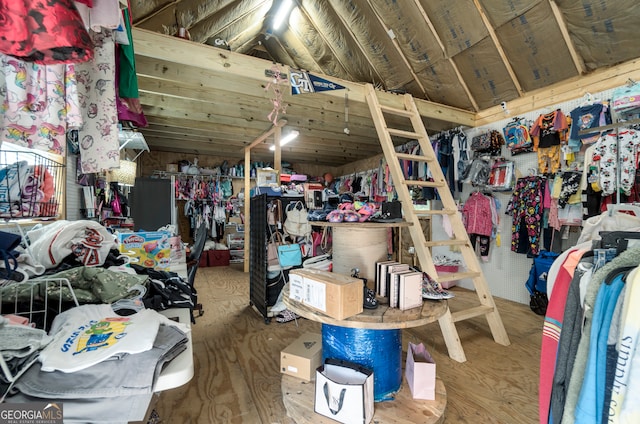 interior space with hardwood / wood-style flooring and lofted ceiling