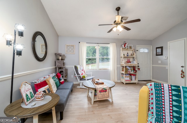 recreation room with light hardwood / wood-style floors, lofted ceiling, and ceiling fan