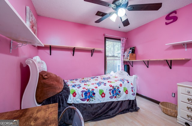 bedroom featuring light hardwood / wood-style floors and ceiling fan