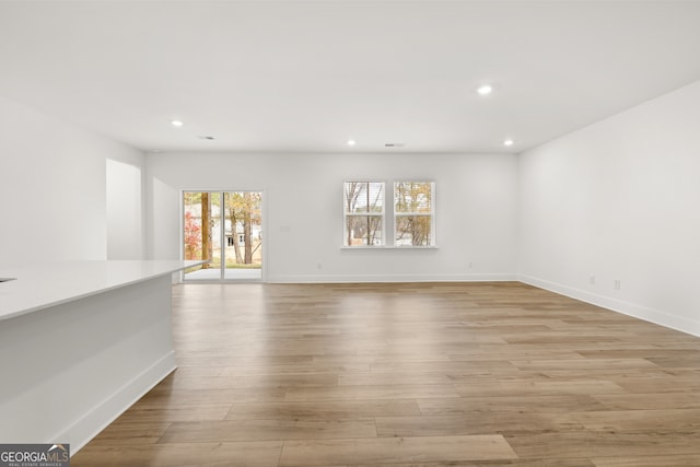 spare room with light wood-type flooring