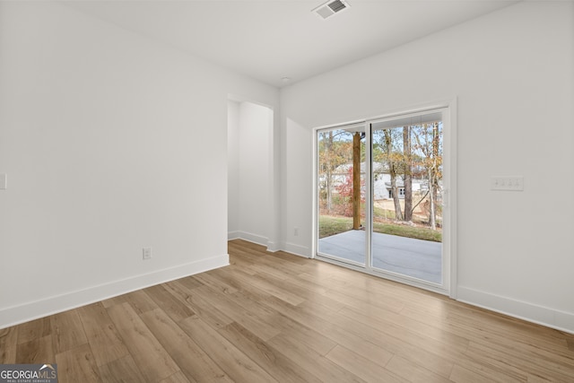 unfurnished room featuring light hardwood / wood-style flooring