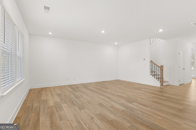 spare room featuring light hardwood / wood-style floors