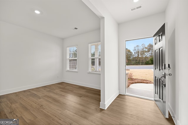 foyer entrance with light wood-type flooring