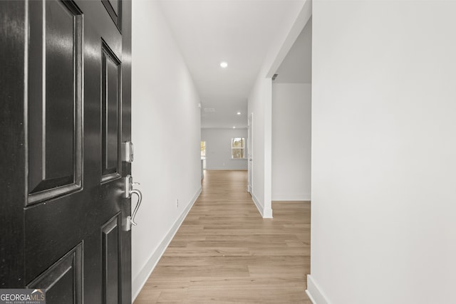 corridor featuring light hardwood / wood-style floors