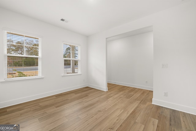 unfurnished room featuring light hardwood / wood-style flooring