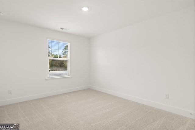 unfurnished room with carpet flooring