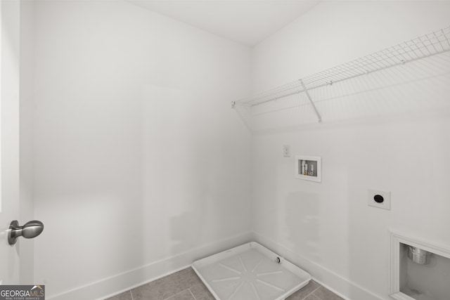 clothes washing area featuring washer hookup, tile patterned floors, and electric dryer hookup