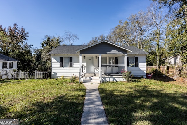 bungalow-style home featuring a porch and a front yard