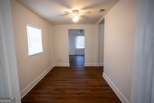 corridor featuring dark wood-type flooring