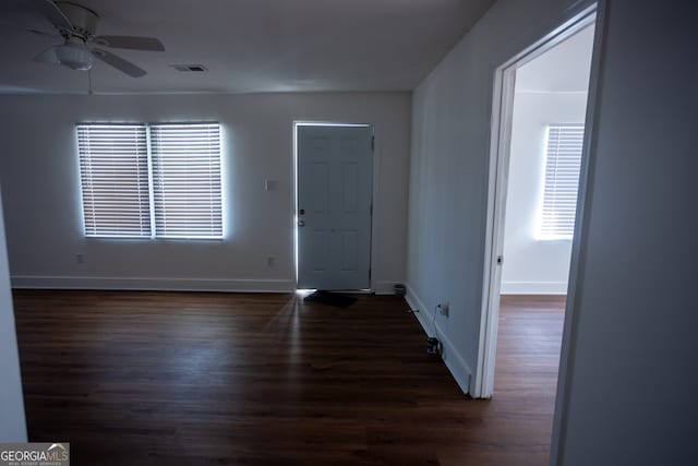 entryway with dark hardwood / wood-style floors and ceiling fan