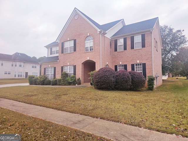 view of front of home with a front lawn