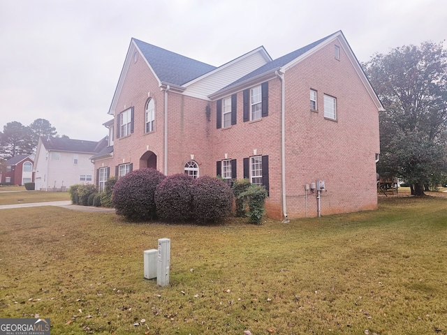 view of property exterior featuring a yard