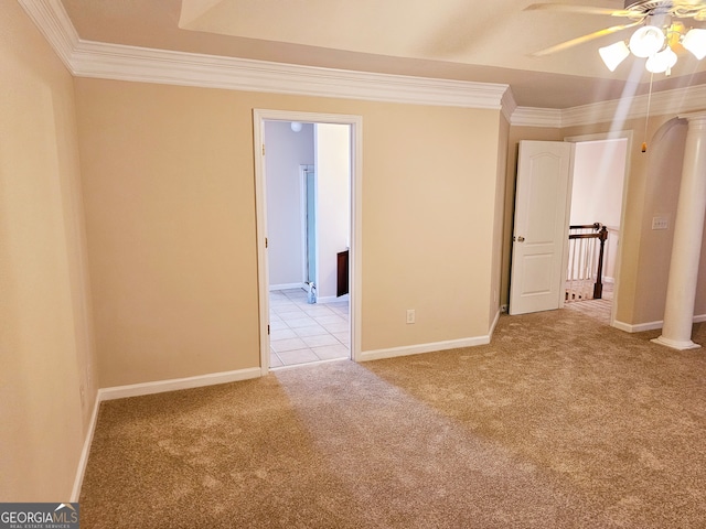 unfurnished room with ornamental molding, light carpet, and ceiling fan