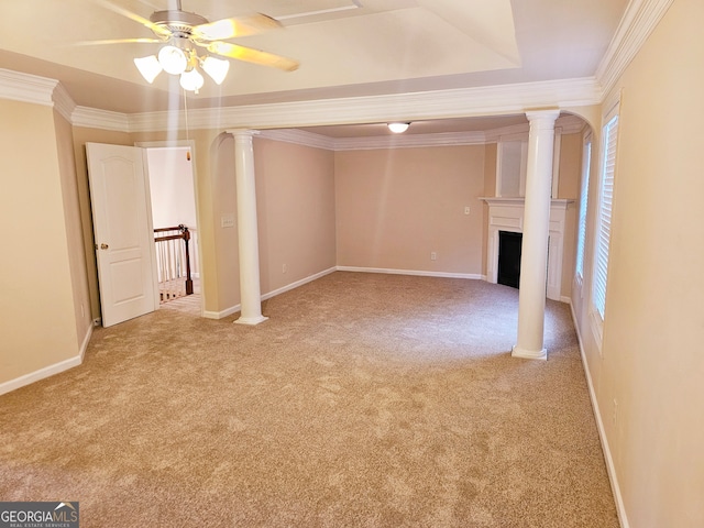 unfurnished living room featuring light carpet, ornamental molding, and ceiling fan