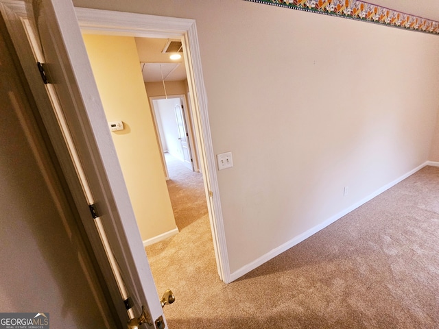 hallway featuring light carpet