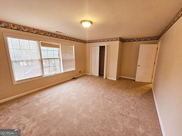 unfurnished bedroom with carpet