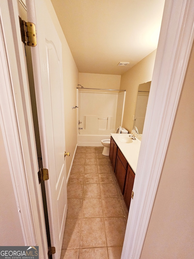 full bathroom featuring vanity, shower / washtub combination, toilet, and tile patterned flooring