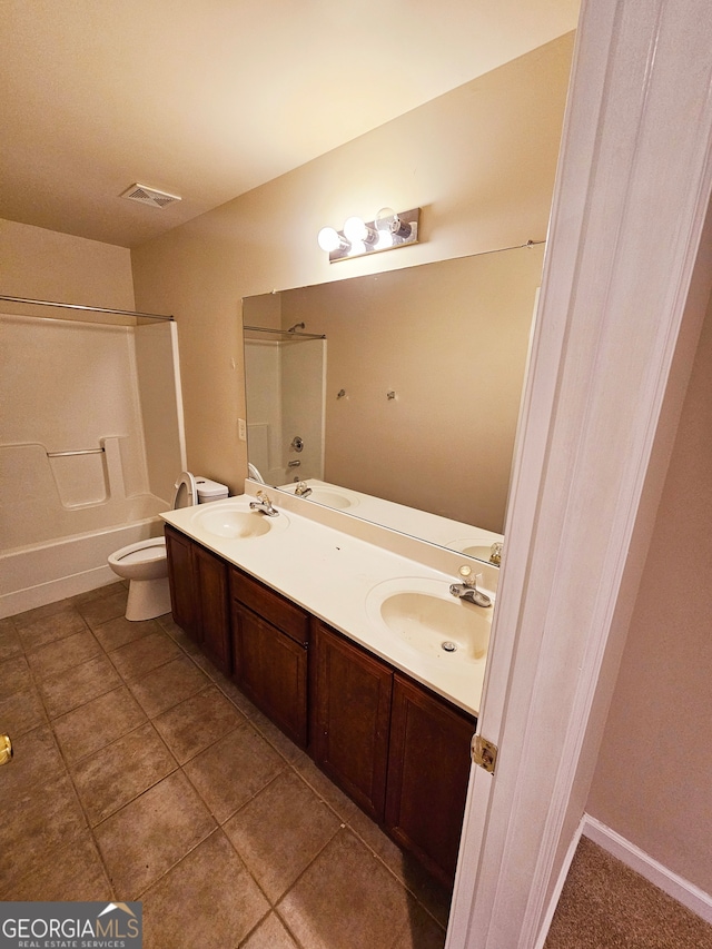 full bathroom featuring vanity, toilet, tile patterned floors, and tub / shower combination